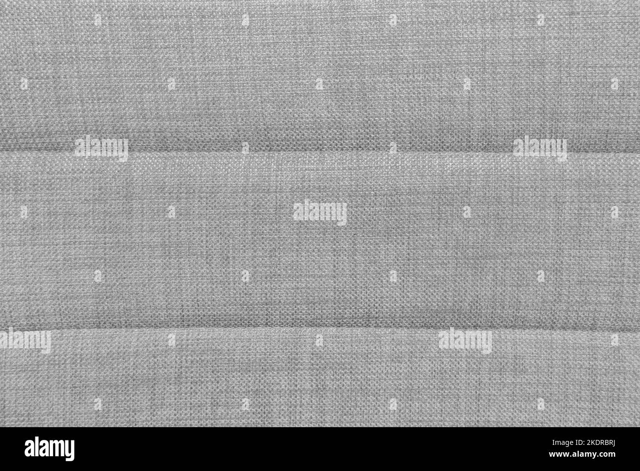 La textura de la alfombra gris. el fondo de tela gris. vista superior.