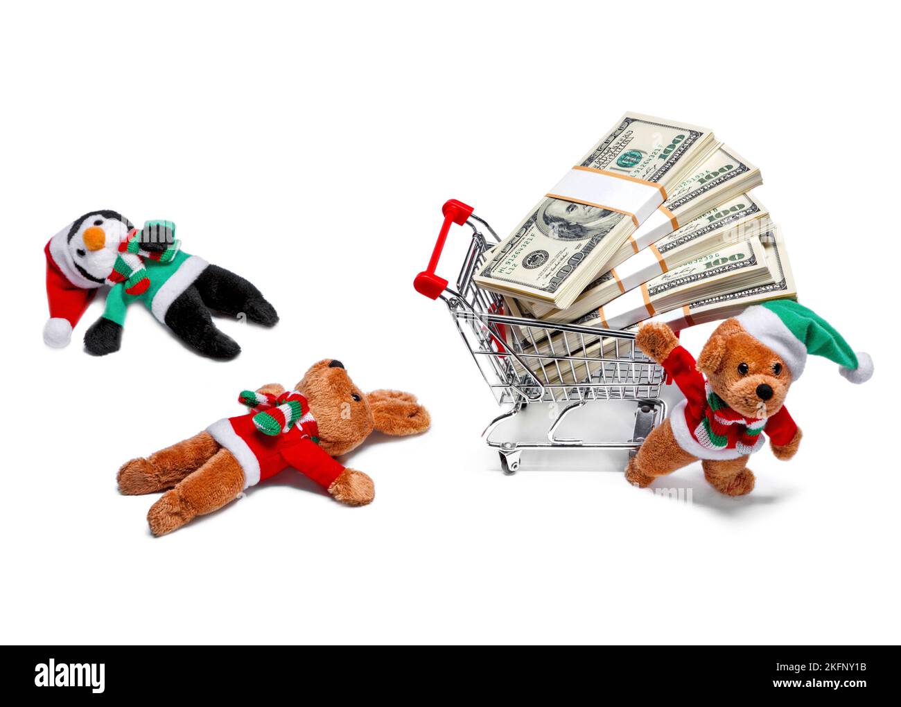 Ayudantes de Santa con un carro de compras lleno de dinero. Divertido concepto de Navidad Foto de stock