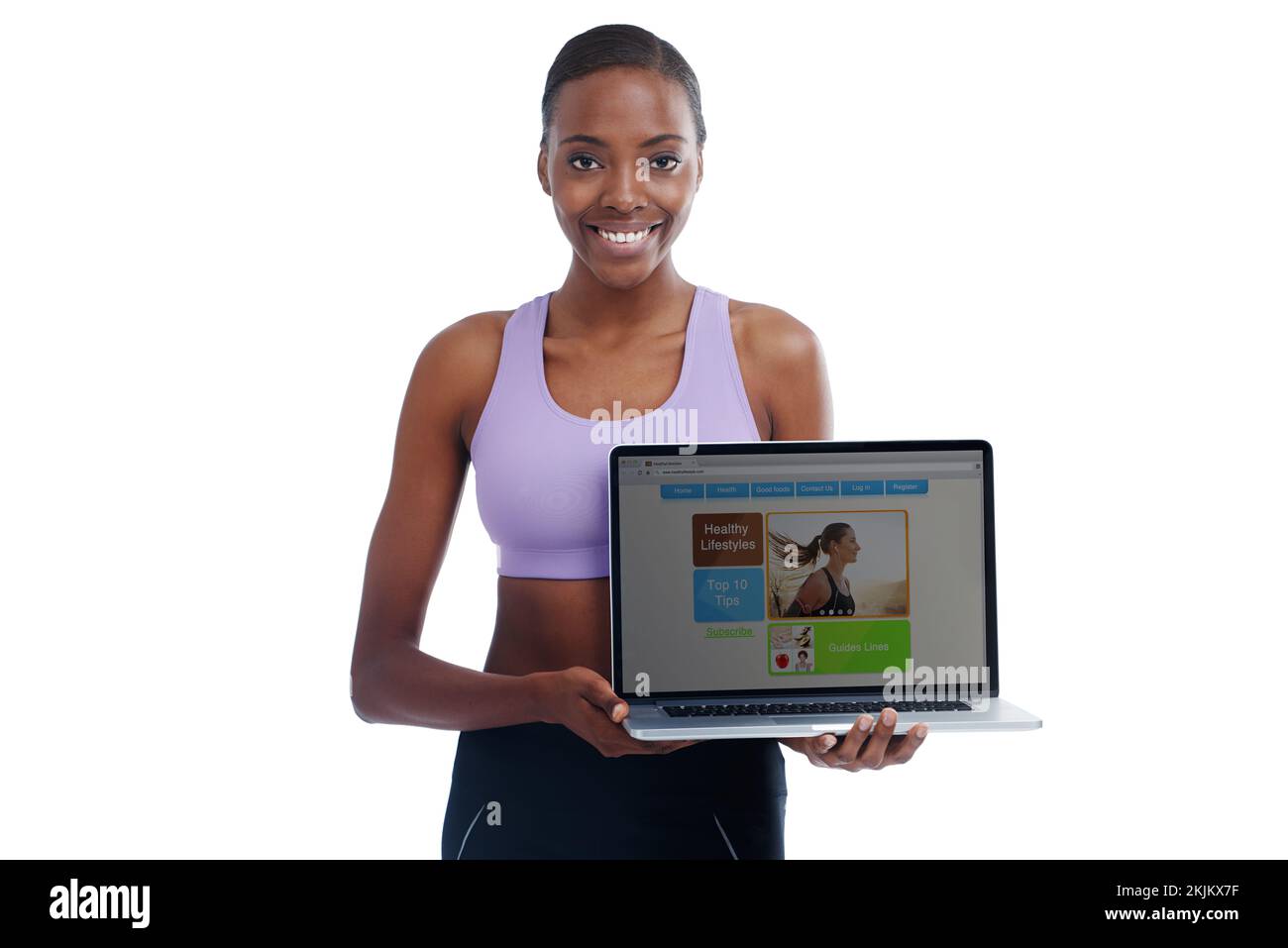 Comenzando su propio Web site de la aptitud. Un retrato de una mujer deportiva feliz mostrando una página web en un portátil. Foto de stock