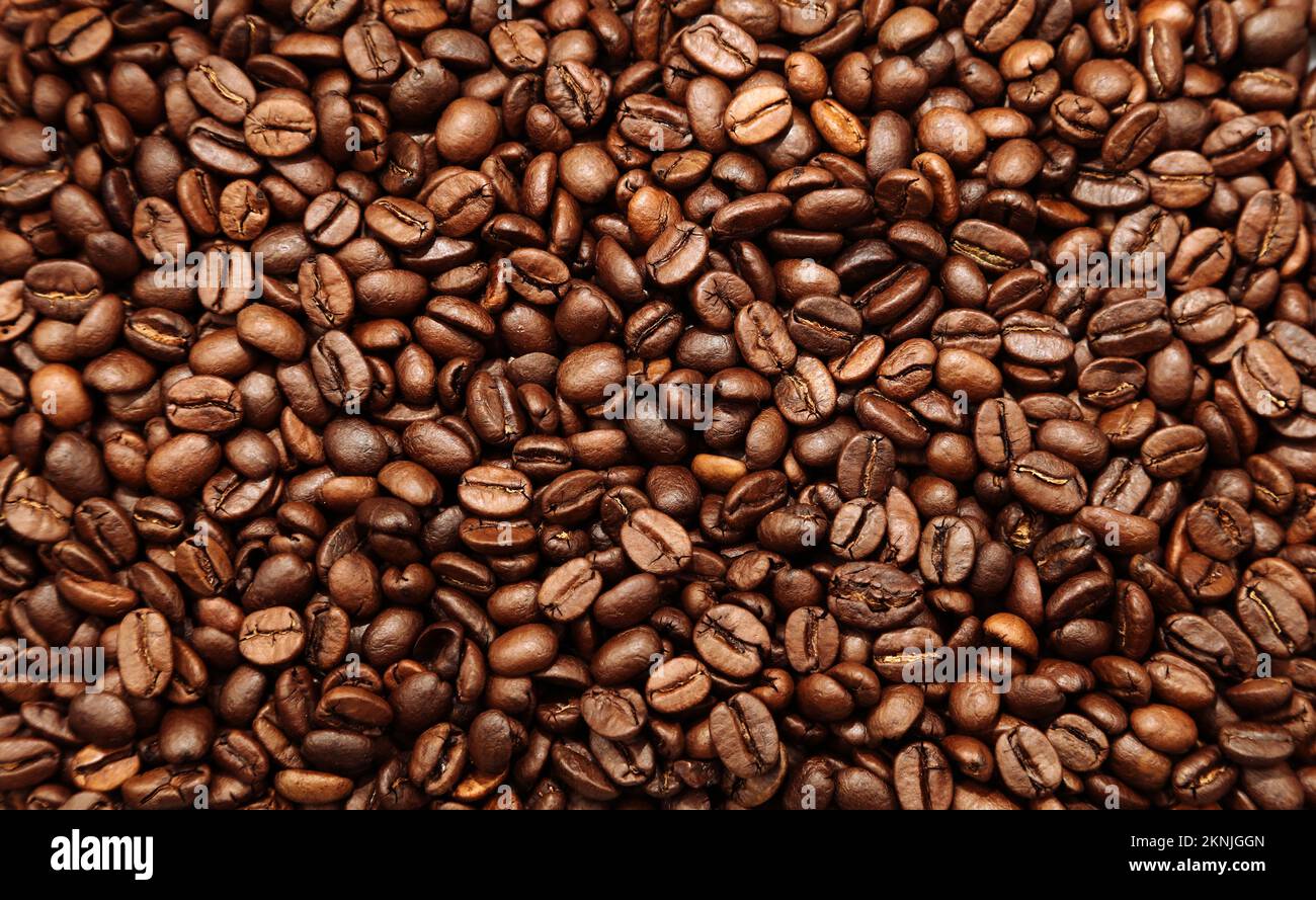 Primer plano de fondo de granos de café tostados Foto de stock