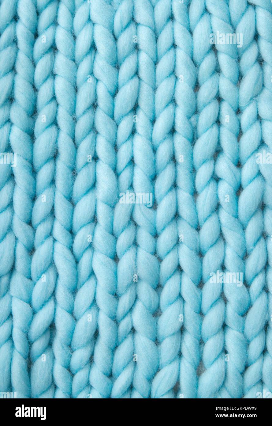Primer plano sobre el fondo de lana de punto de color azul claro. Foto de stock