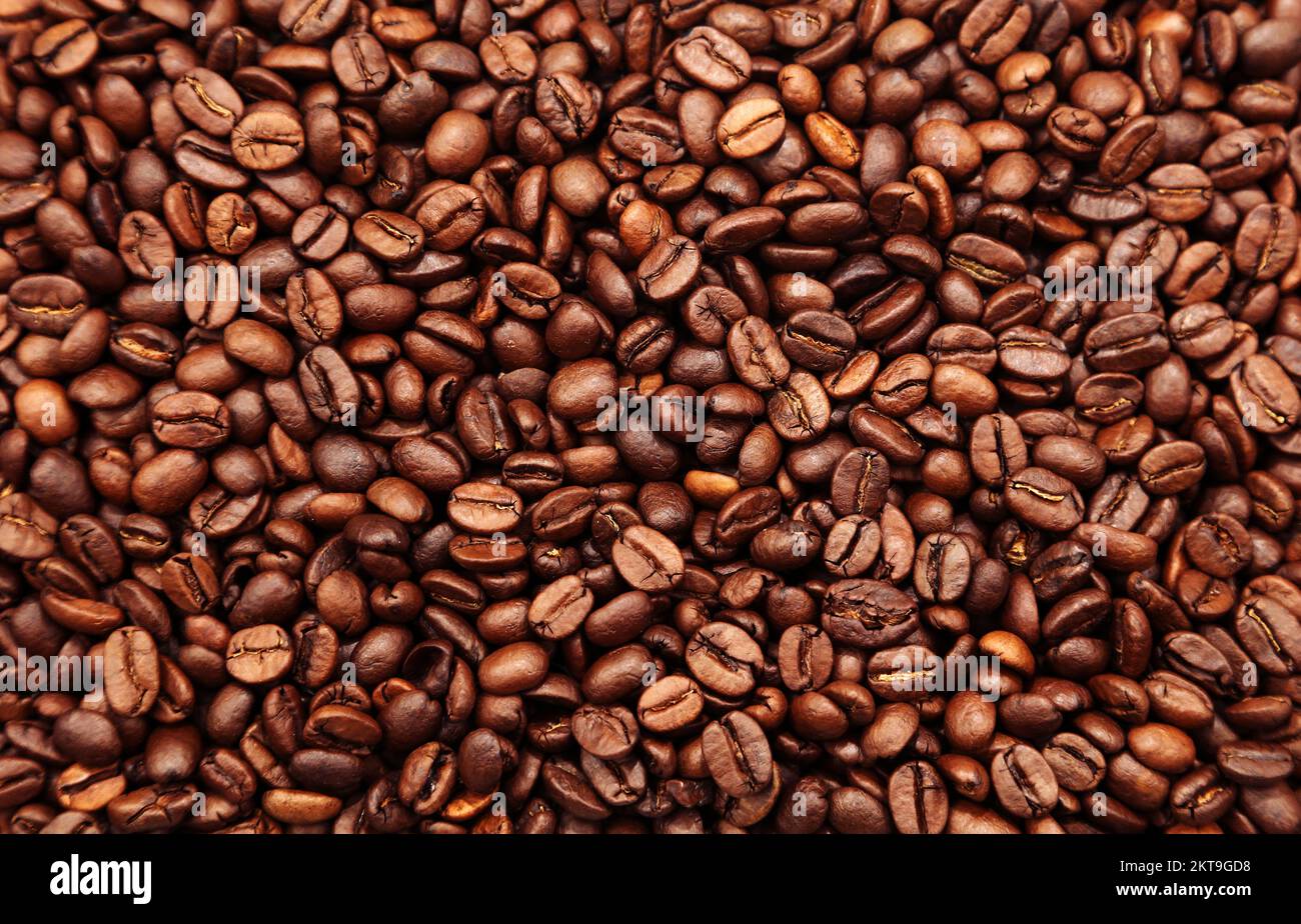 Primer plano de fondo de granos de café tostados Foto de stock