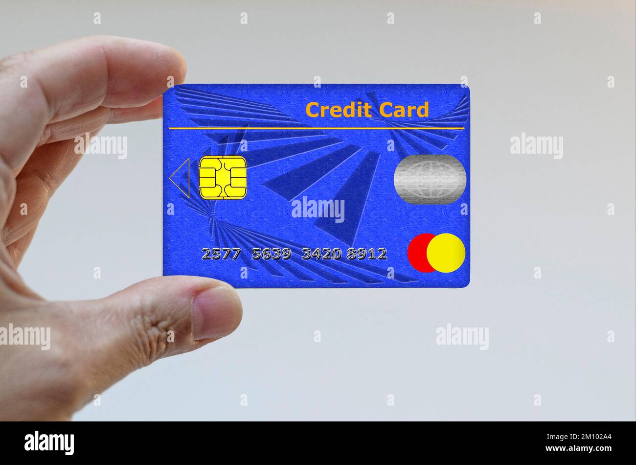 Mano sujetando una tarjeta de crédito Foto de stock