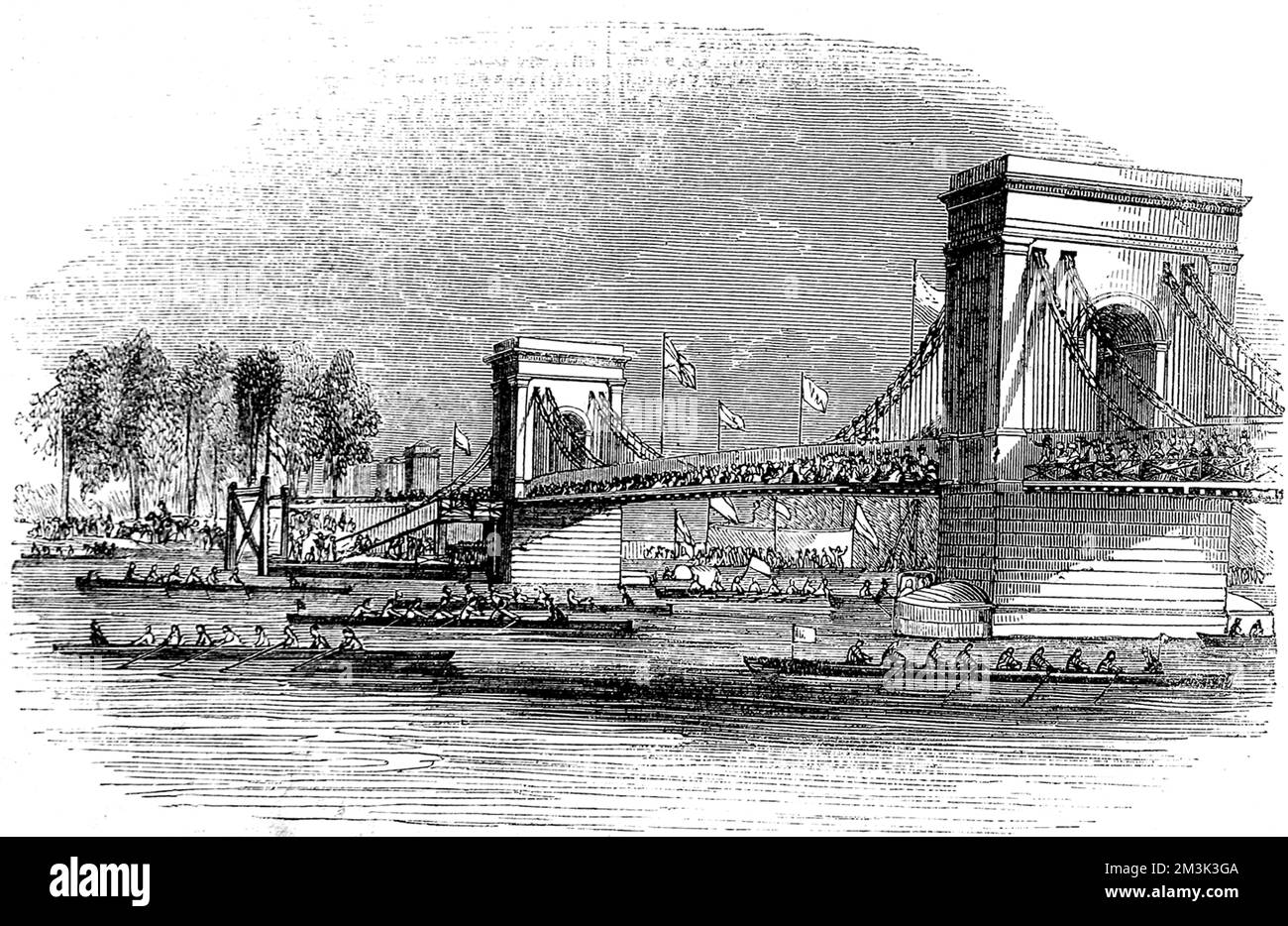 Barcos de remo, participando en la Regata del Támesis de 1843, pasando por el puente colgante Hammersmith. 1843 Foto de stock