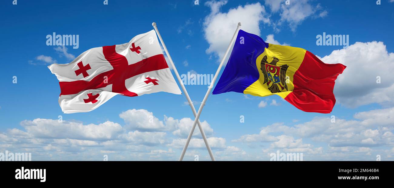 Dos banderas cruzadas Moldavia y ondeando en el viento en el