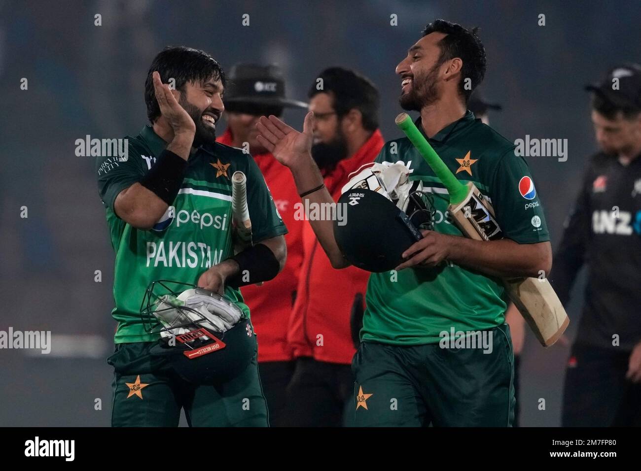 Pakistan's Mohammad Rizwan, left, celebrates with Agha Salman after
