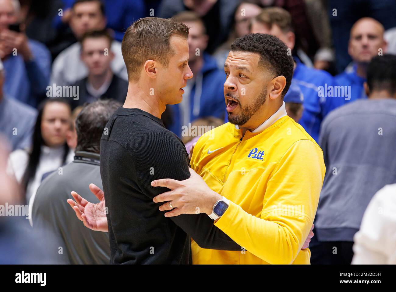 Duke head coach Jon Scheyer, left, and Pittsburgh head coach Jeff Capel