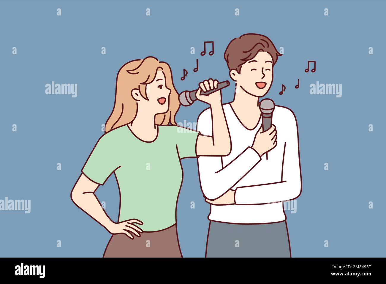 El hombre y la mujer con los micrófonos realizan la canción mientras