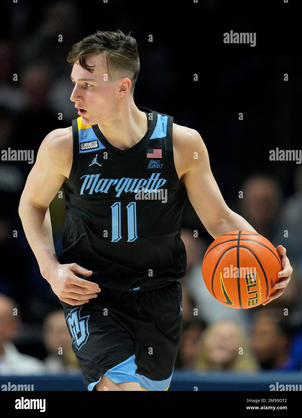 Marquette guard Tyler Kolek (11) controls the ball during the second