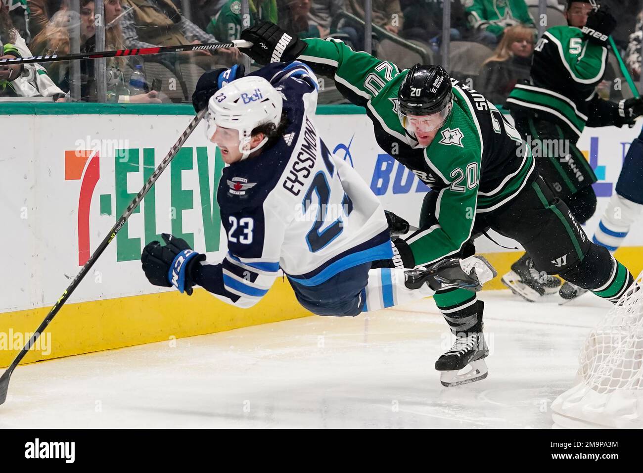 Winnipeg Jets center Michael Eyssimont (23) is knocked off his feet by