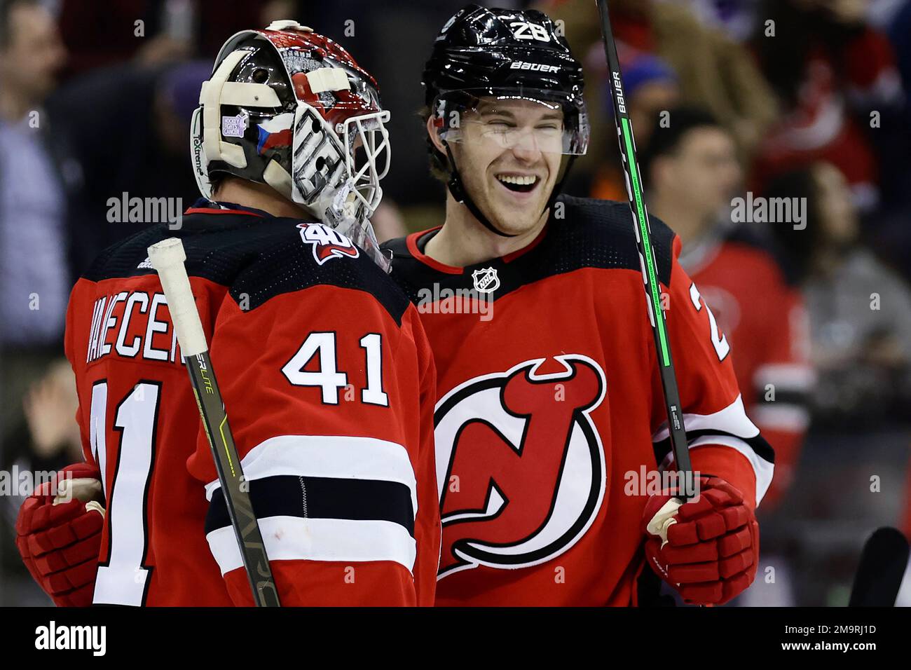 New Jersey Devils goaltender Vitek Vanecek celebrates with John Marino (6)  after defeating the Washington Capitals in an NHL hockey game Saturday,  Nov. 26, 2022, in Newark, N.J. (AP Photo/Adam Hunger Stock