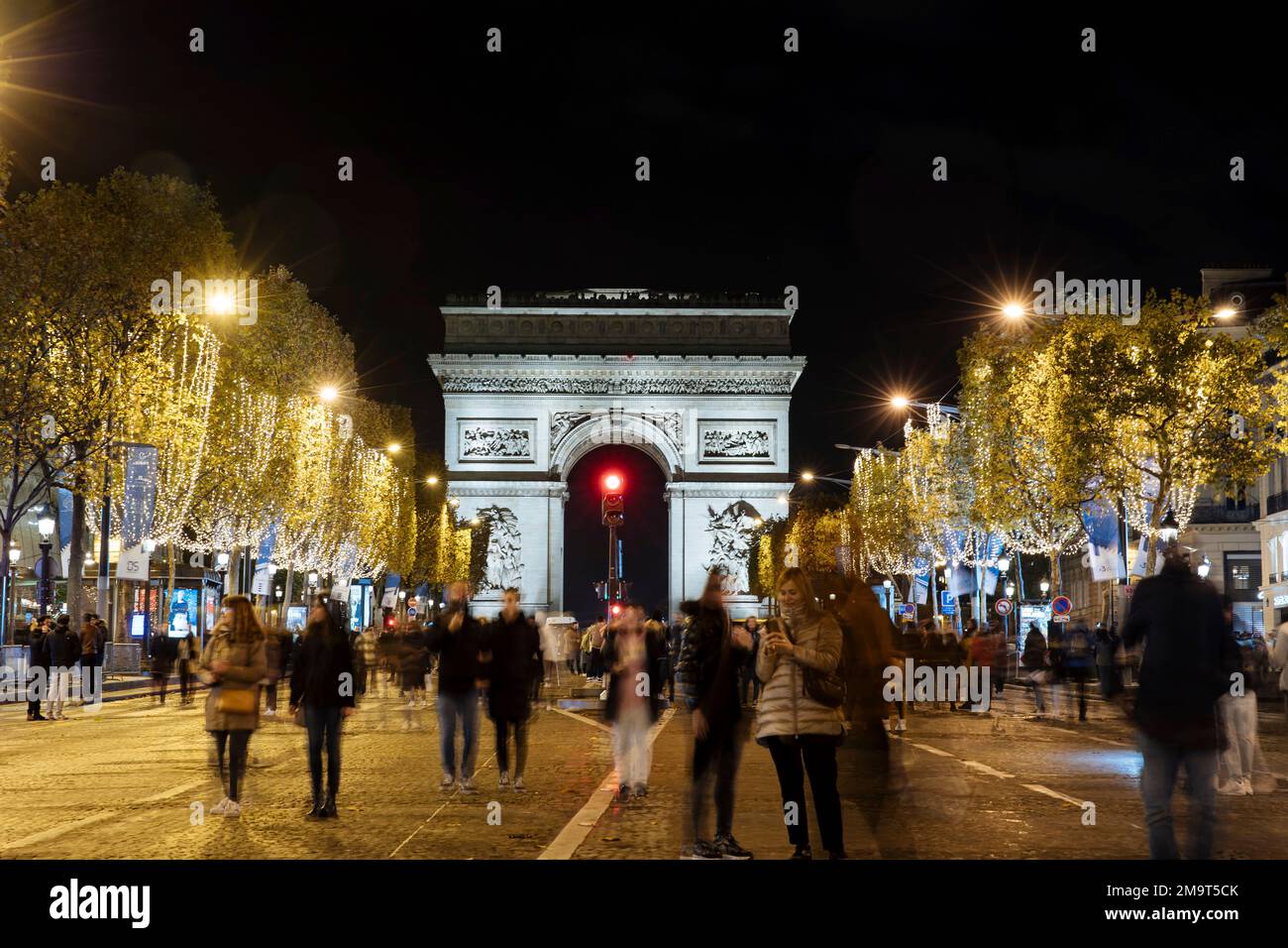 Spectators gather to attend the Champs Elysee Avenue illumination