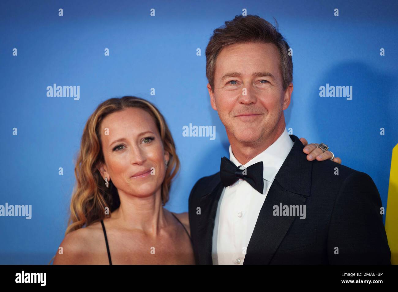 Shauna Robertson, left, Edward Norton pose for photographers upon