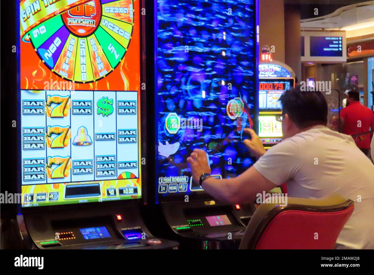 A gambler plays a slot machine at the Hard Rock casino in Atlantic City,  N.J. on Aug. 8, 2022. Figures released by New Jersey gambling regulators on  Tuesday, Aug. 16, 2022 show