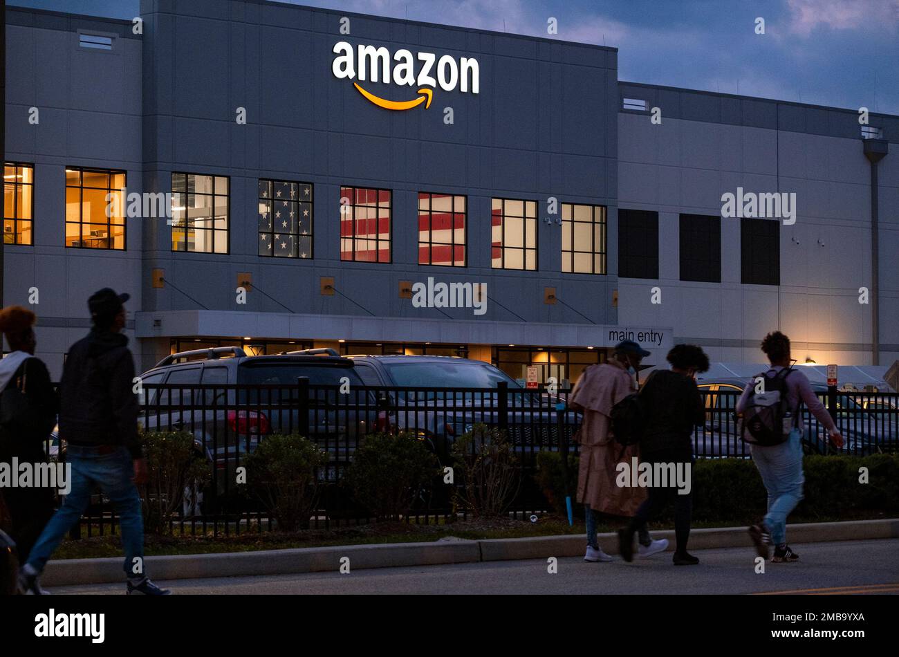 FILE People arrive for work at the Amazon distribution center in the