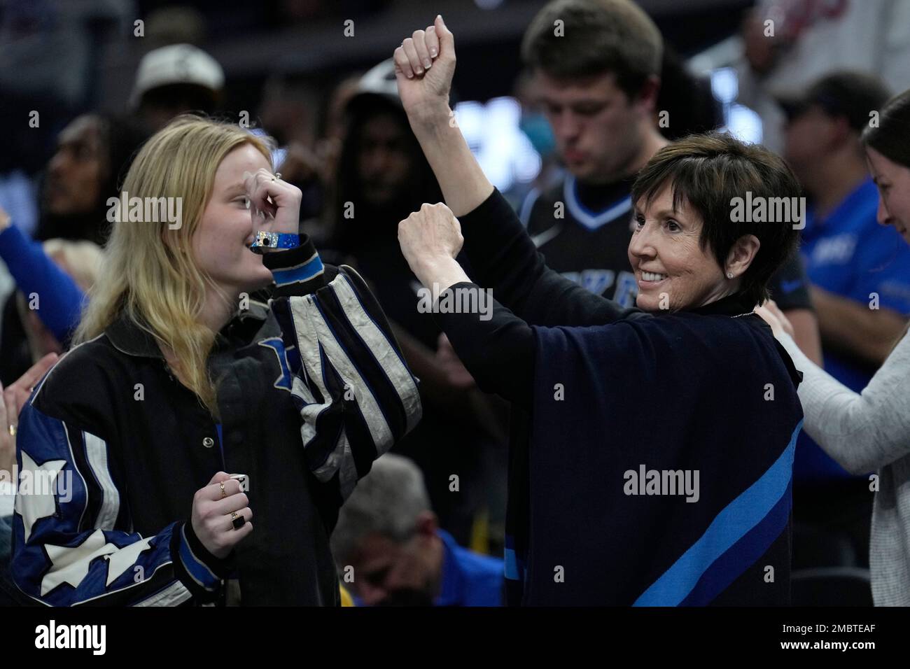 Mickie Krzyzewski, the wife of Duke head coach Mike Krzyzewski, right