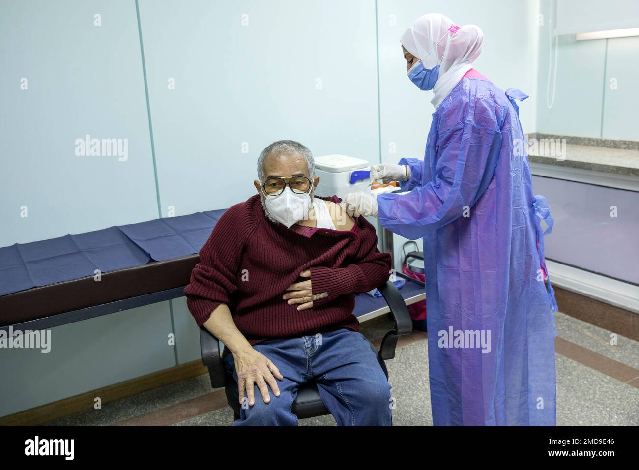 FILE In this March 4, 2021 file photo, a man receives the AstraZeneca