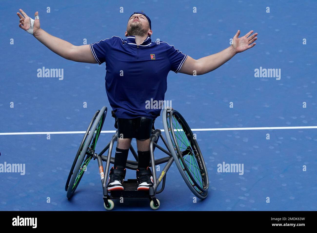 Dylan Alcott, of Australia, reacts after defeating Niels Vink, of the  Netherlands, during the men's wheelchair quad singles final at the U.S.  Open tennis tournament in New York, Sunday, Sept. 12, 2021. (