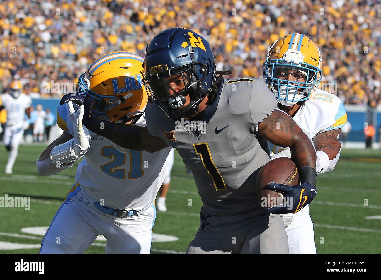 West Virginia wide receiver Winston Wright Jr. (1) is defended by Long Island defensive back