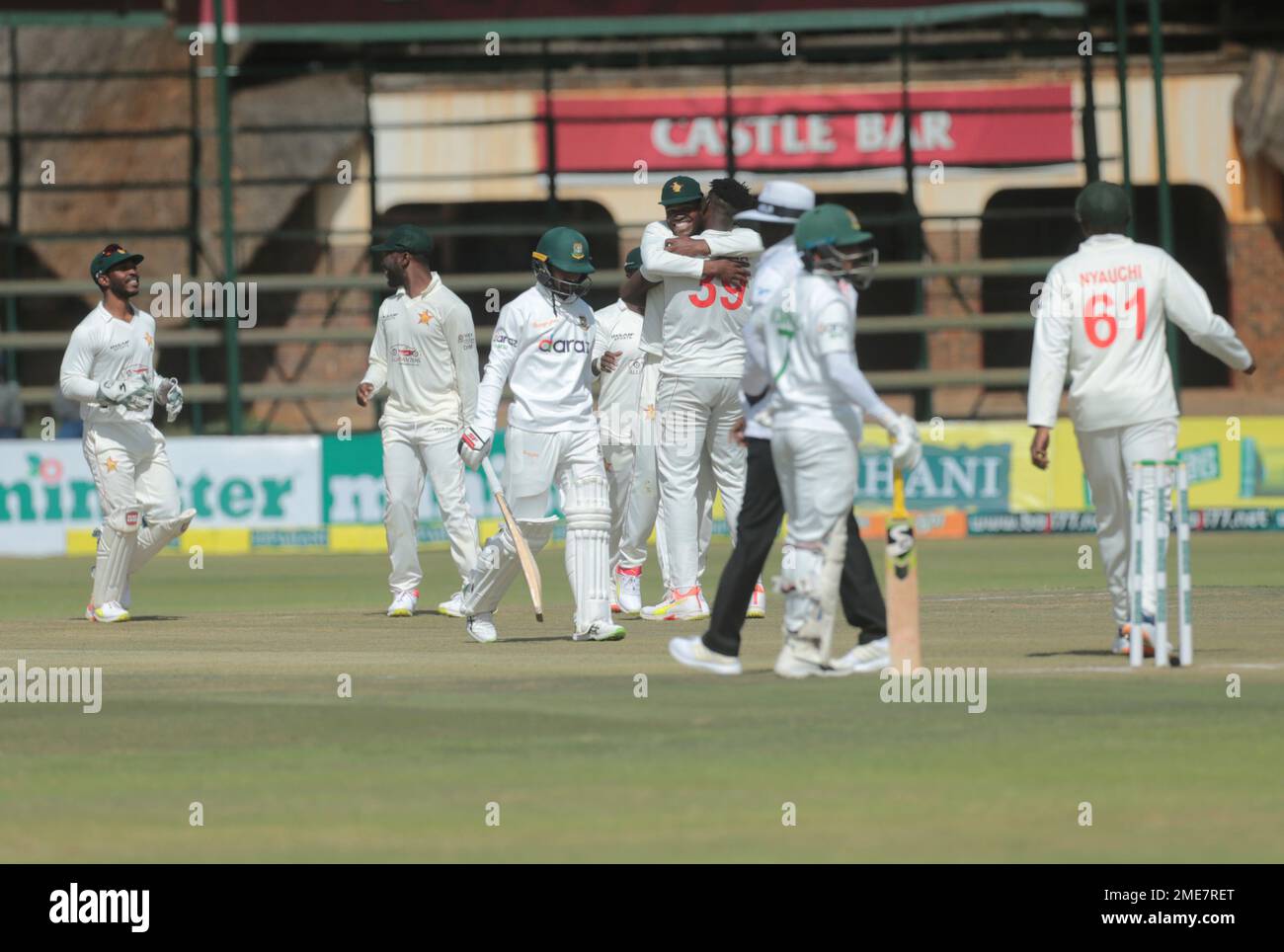 Zimbabwean cricket players celebrate the wicket of Bangladesh batsman