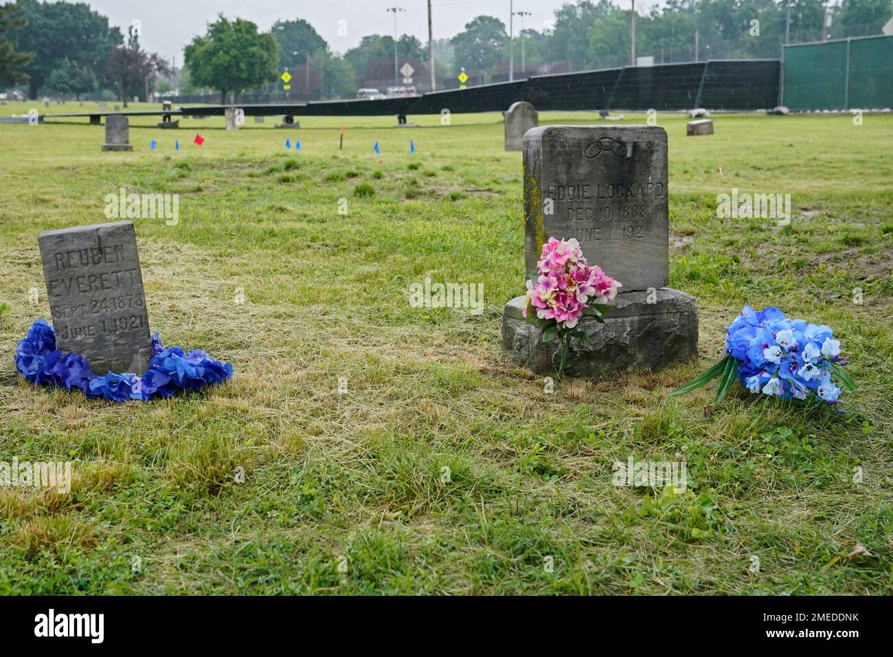 The headstones of Reuben Everett, left, and Eddie Lockard, right