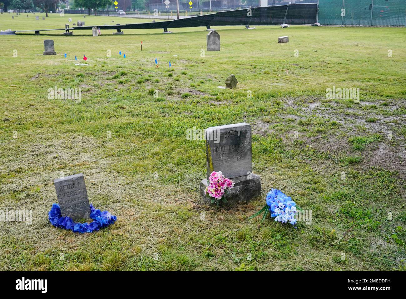 The headstones of Reuben Everett, left, and Eddie Lockard, right
