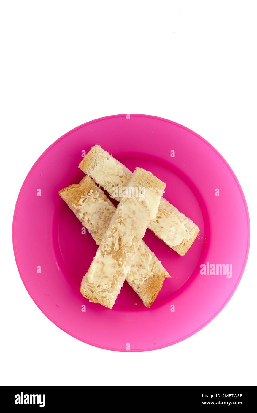 Tostadas con mantequilla cortadas en tiras Foto de stock