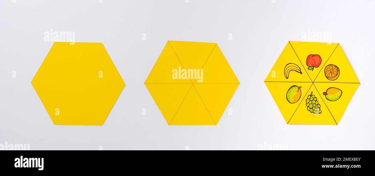 Hexágonos amarillos, lisos, divididos en 6 y divididos en 6 con dibujos de  frutas Fotografía de stock - Alamy