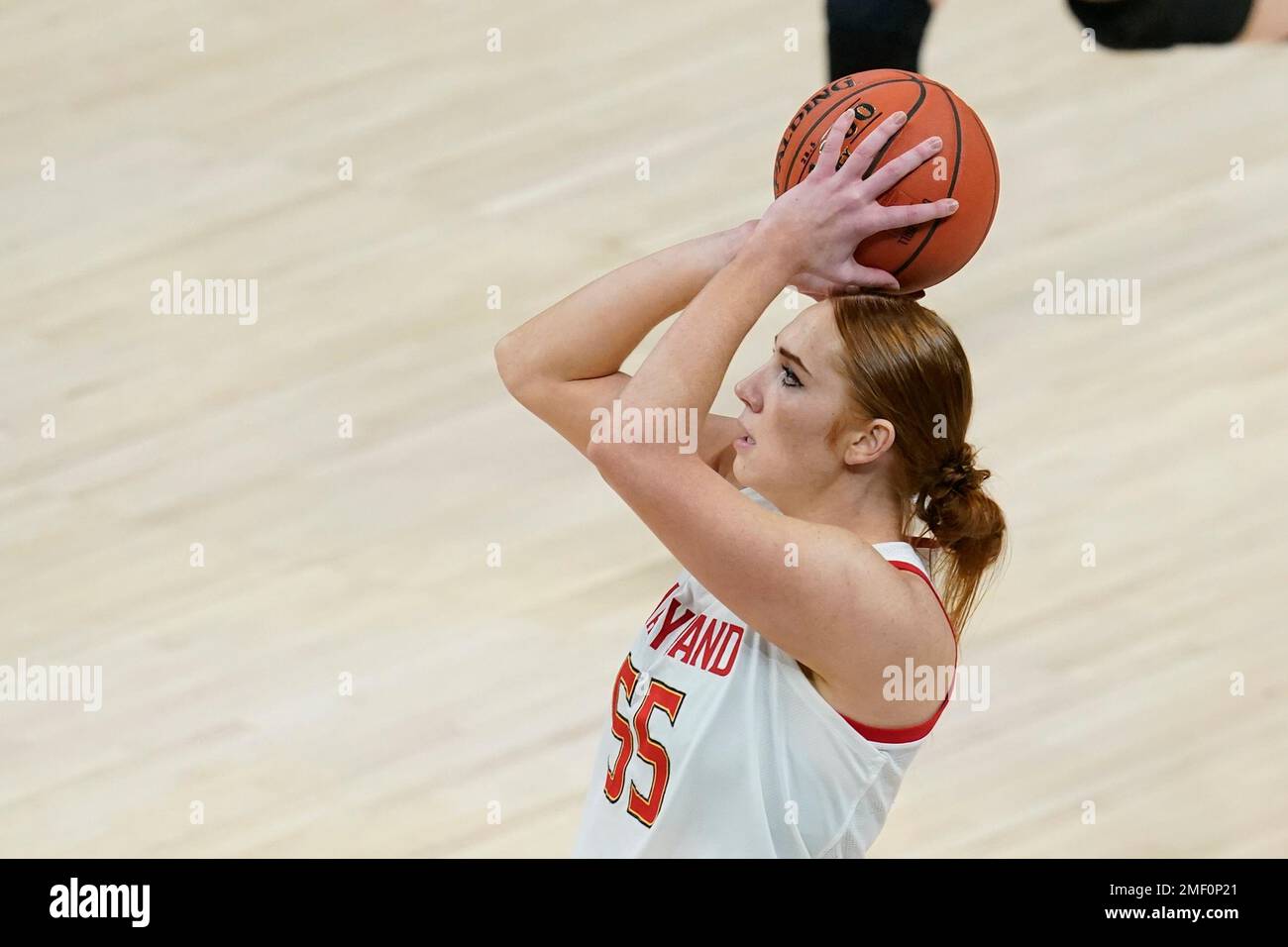 Maryland's Chloe Bibby (55) shoots during the first half of an NCAA