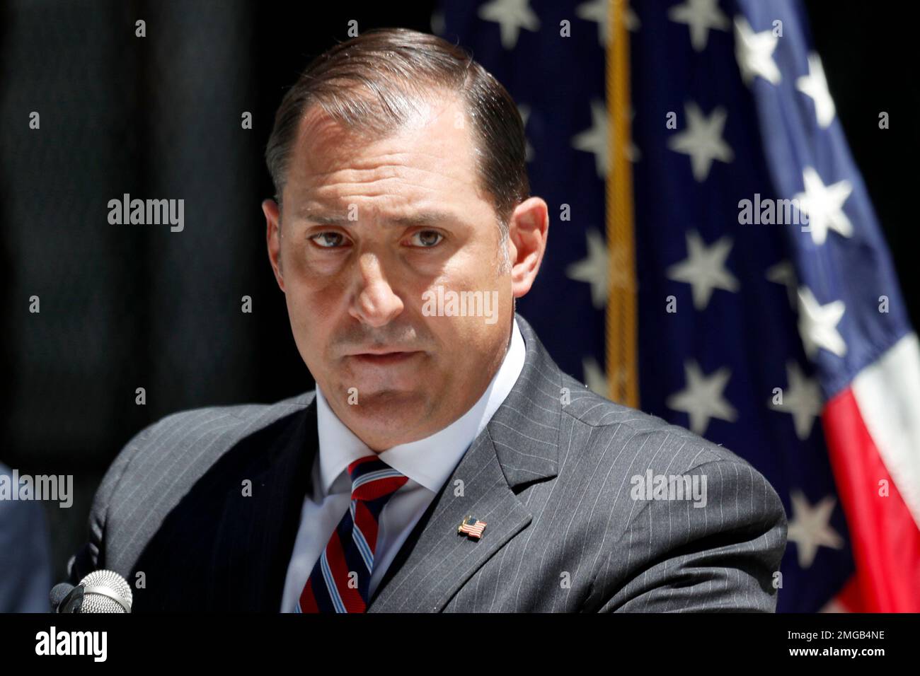 U.S. attorney for the Northern District of Illinois, John R. Lausch Jr., listens Friday, July 17