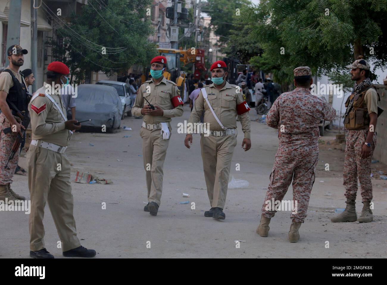 Pakistan army soldiers stand guard while they cordon off a street