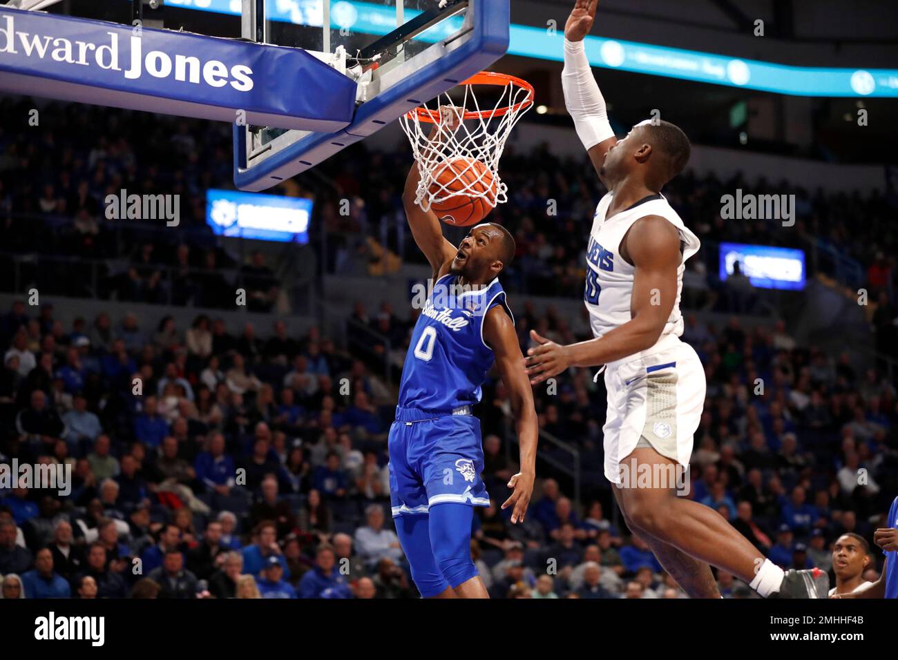 Seton Hall's Quincy McKnight (0) dunks as Saint Louis' Fred Thatch Jr