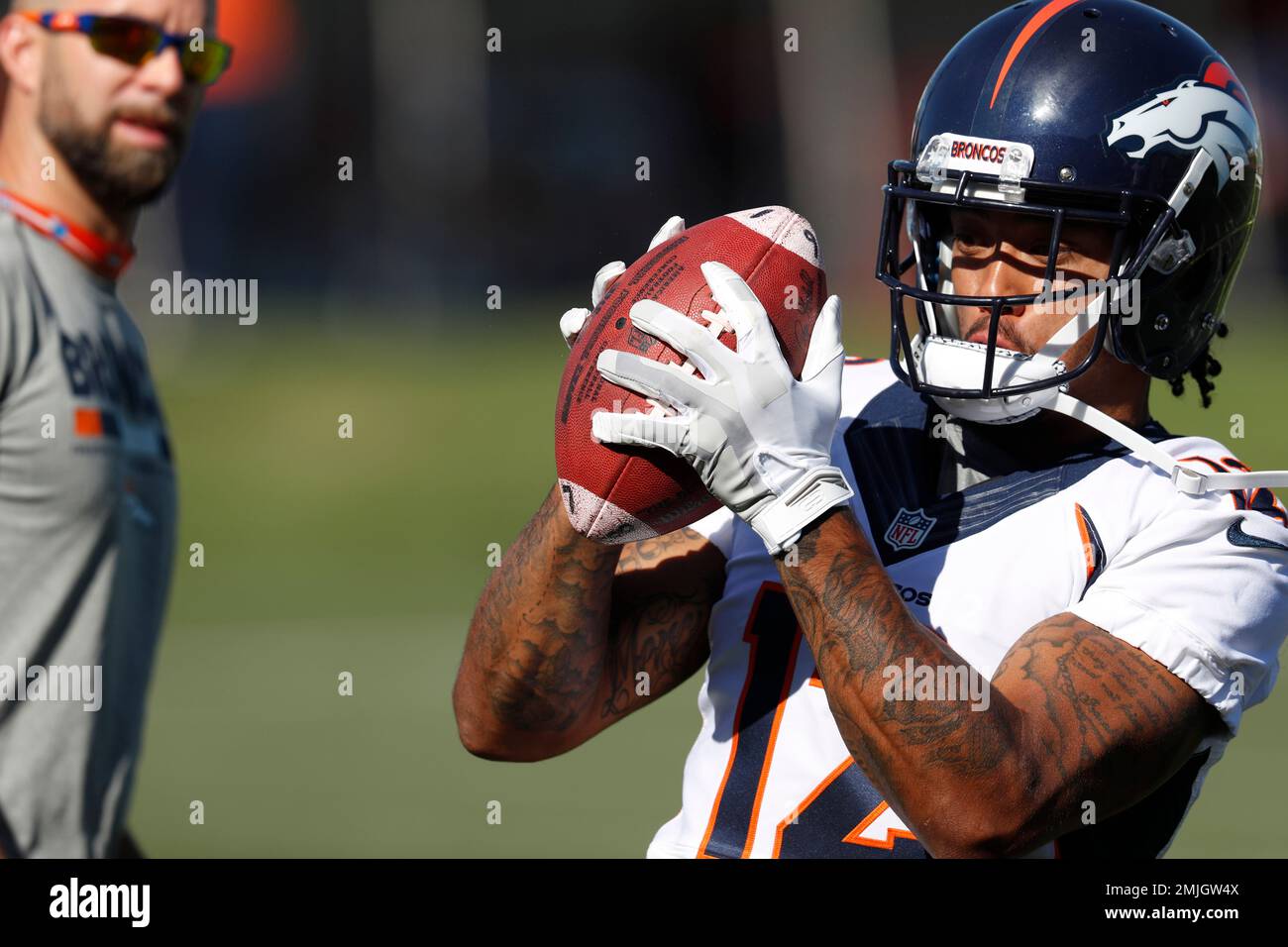 Denver Broncos wide receiver Brendan Langley (12) warms up during an NFL  training camp practice at the team's headquarters Tuesday, July 30, 2019,  in Englewood, Colo. (AP Photo/David Zalubowski Stock Photo - Alamy