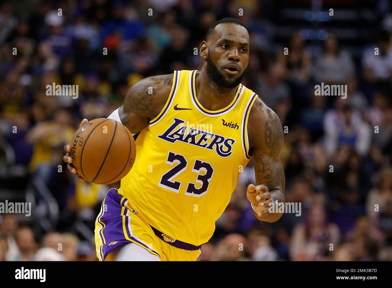 FILE - In this Saturday, March 2, 2019 file photo, Los Angeles Lakers  forward LeBron James (23) controls the ball in the second half during an  NBA basketball game against the Phoenix