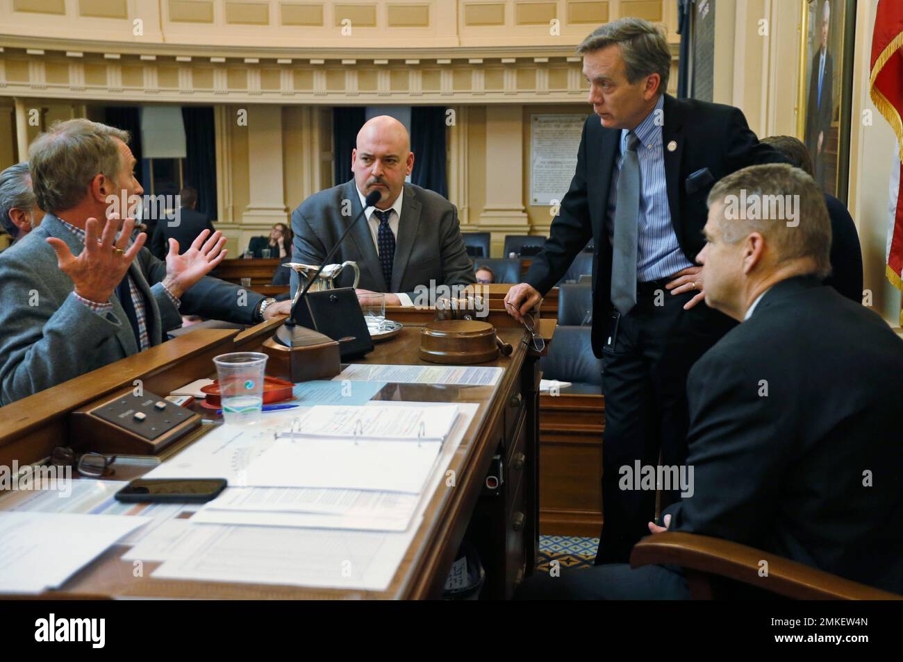 Clerk of the Virginia House of Delegates, Paul Nardo, left, gestures as he discusses the House