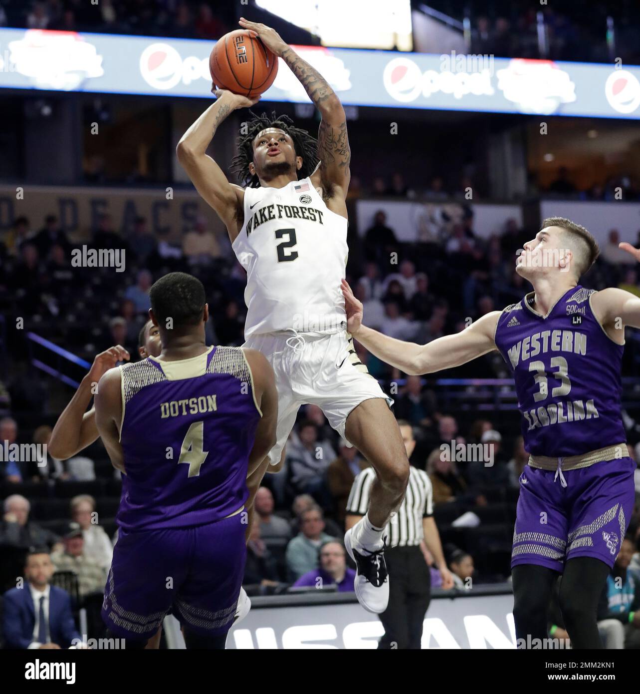 Wake Forest's Sharone Wright Jr. (2) shoots against Western Carolina's