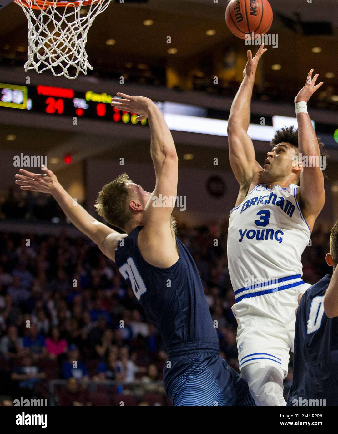 BYU's Elijah Bryant (3) shoots over San Diego's Cameron Neubauer (20