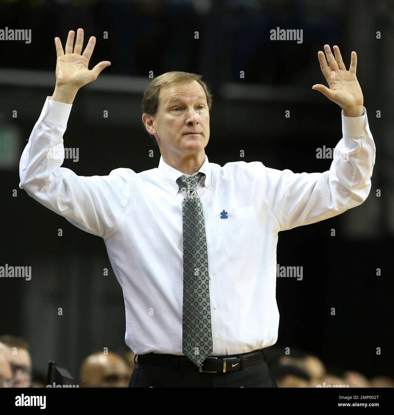 Oregon head basketball coach Dana Altman gestures toward his team