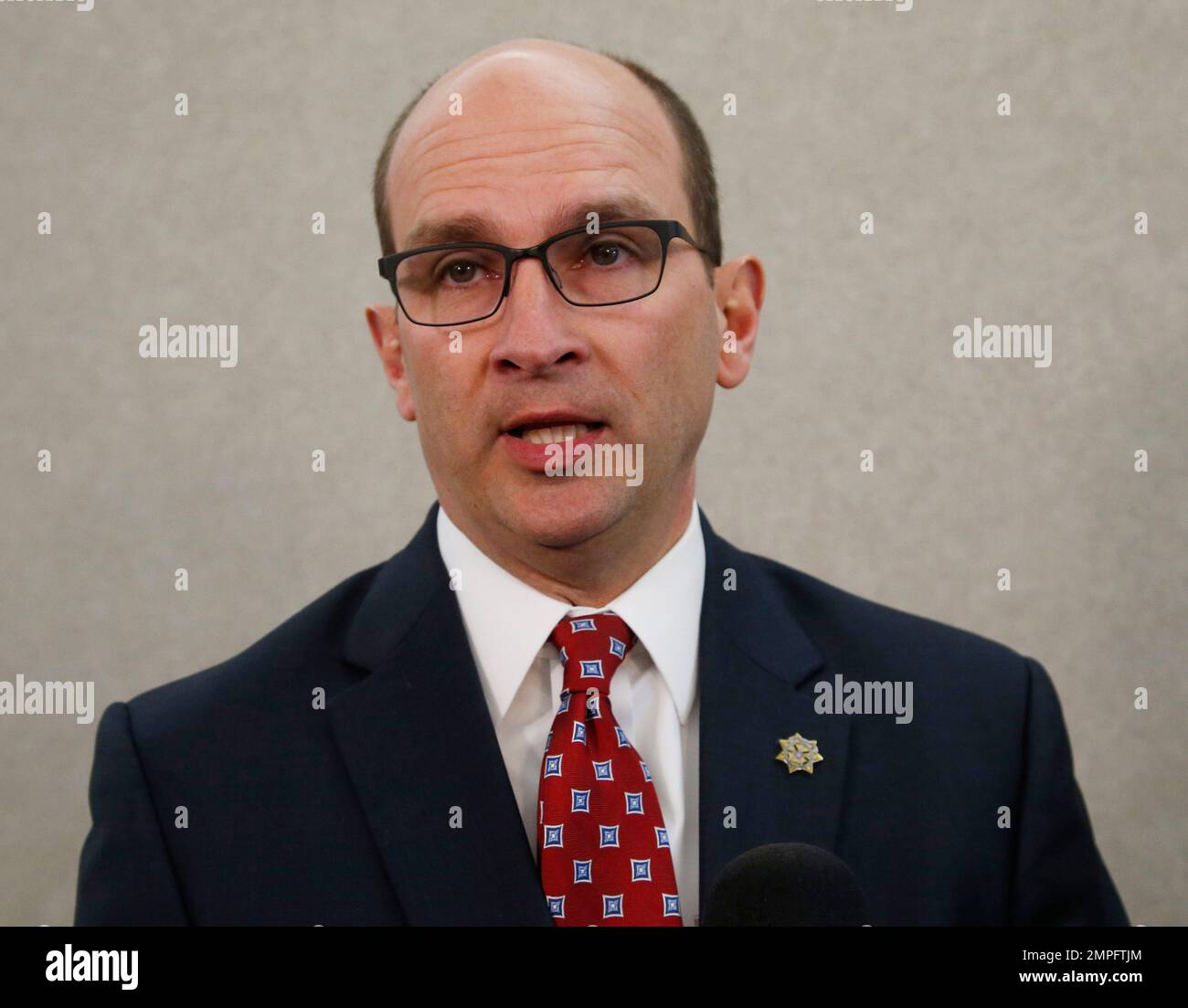 Cleveland County District Attorney Greg Mashburn talks with the media