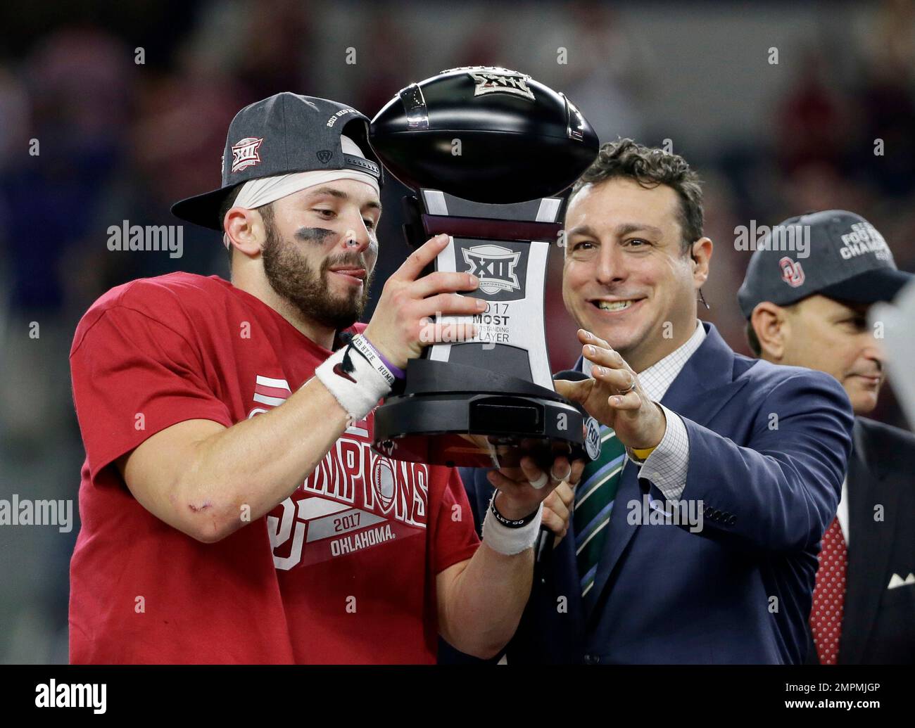 Oklahoma quarterback Baker Mayfield, left, is presented with the Most