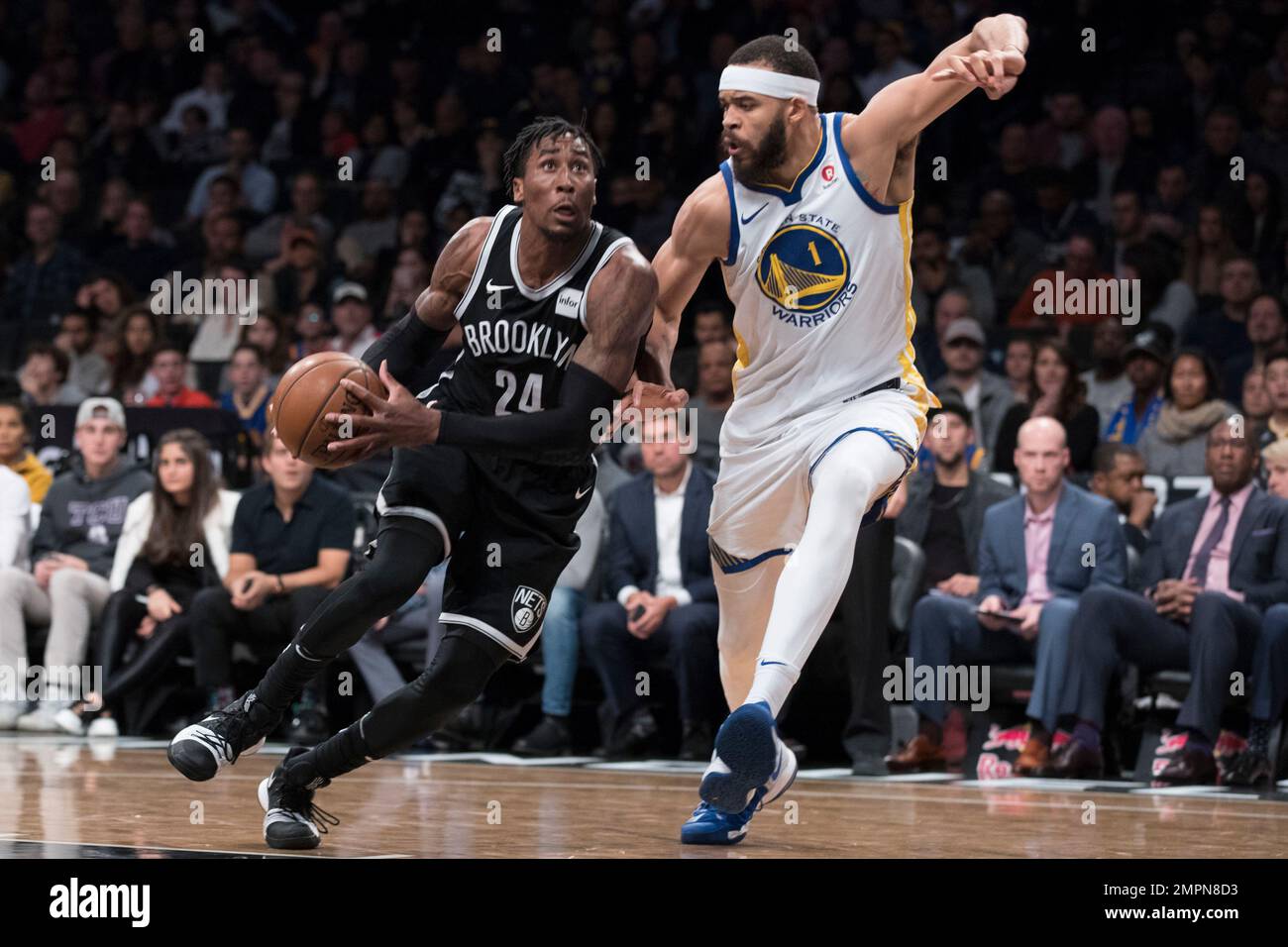 Brooklyn Nets forward Rondae Hollis-Jefferson (24) drives to the basket  against Golden State Warriors center JaVale McGee (1) during the second  half of an NBA basketball game, Sunday, Nov. 19, 2017, in