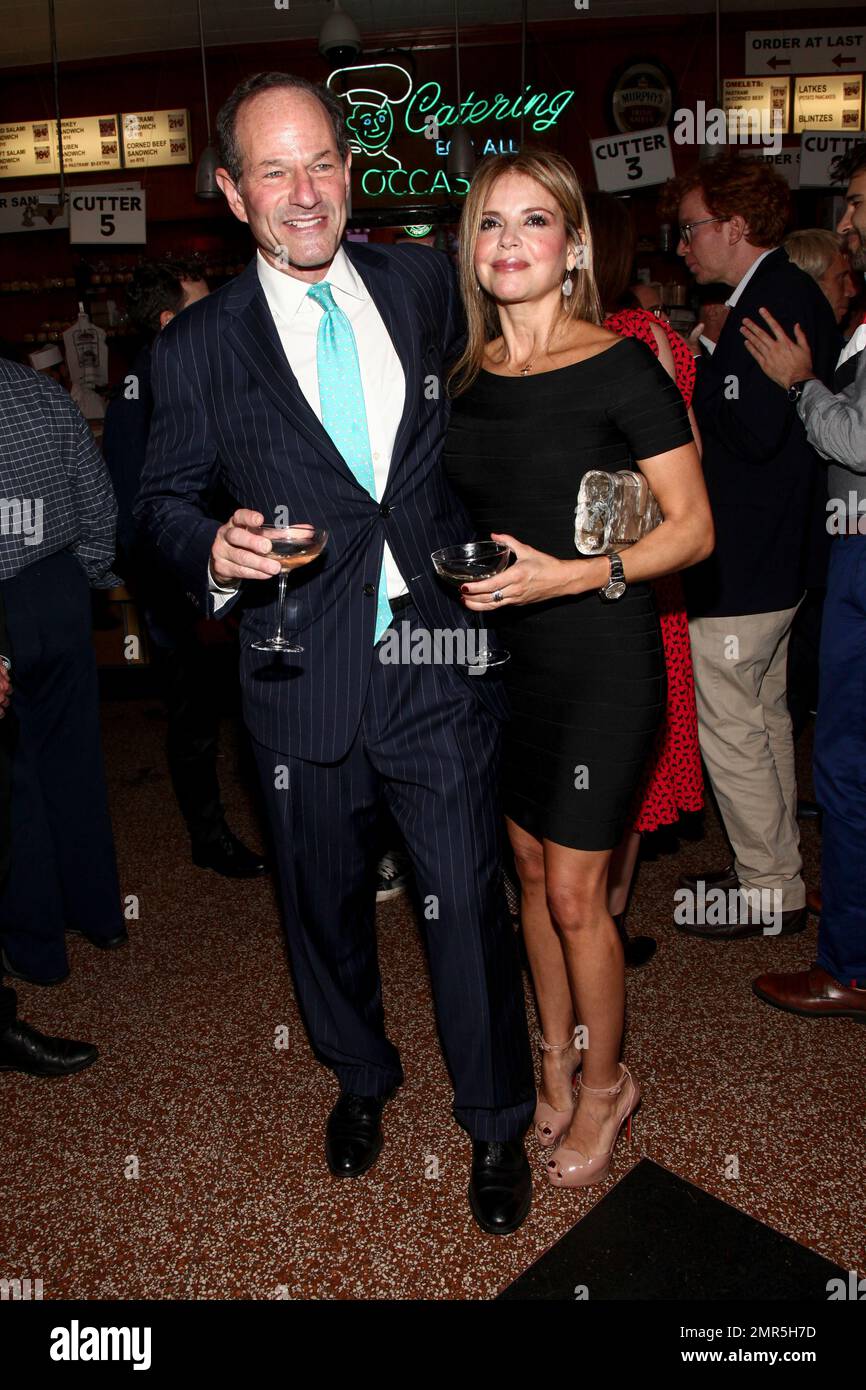 Eliot Spitzer, left, and Roxana Girand, right, attend New York Magazine