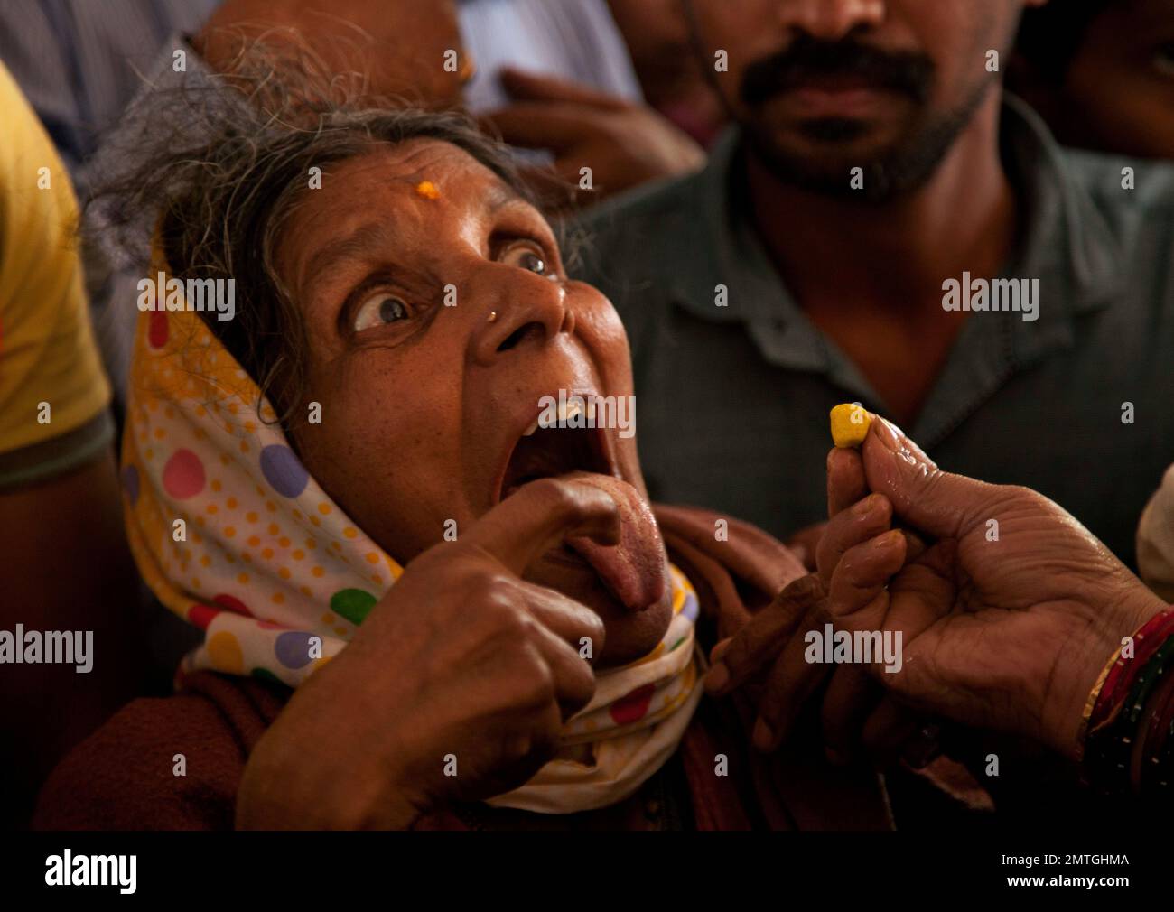 An Indian asthma patient is administered 'fish medicine' in Hyderabad