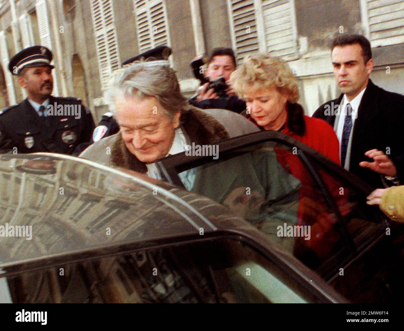 FILE Former Foreign Minister Roland Dumas enters a car followed by
