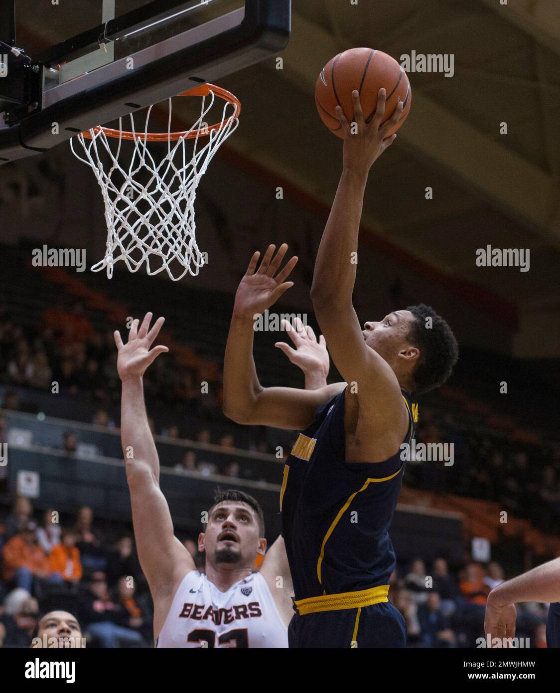 California's Ivan Rabb, right, shoots over Oregon State's Gligorije Rakocevic during the second