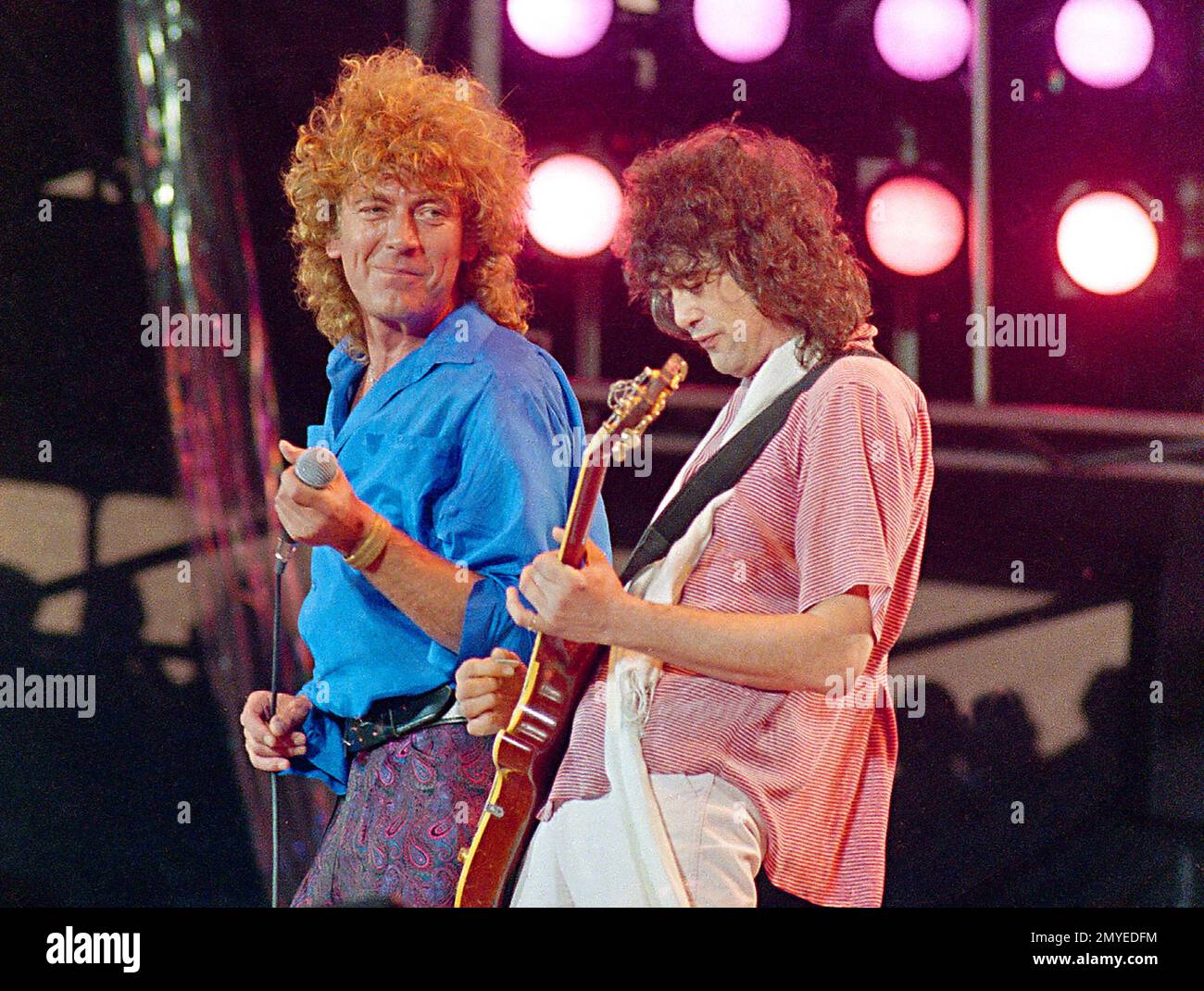 FILE - In this July 13, 1985 file photo, Led Zeppelin bandmates, singer  Robert Plant, left, and guitarist Jimmy Page, reunite to perform for the  Live Aid famine relief concert at JFK