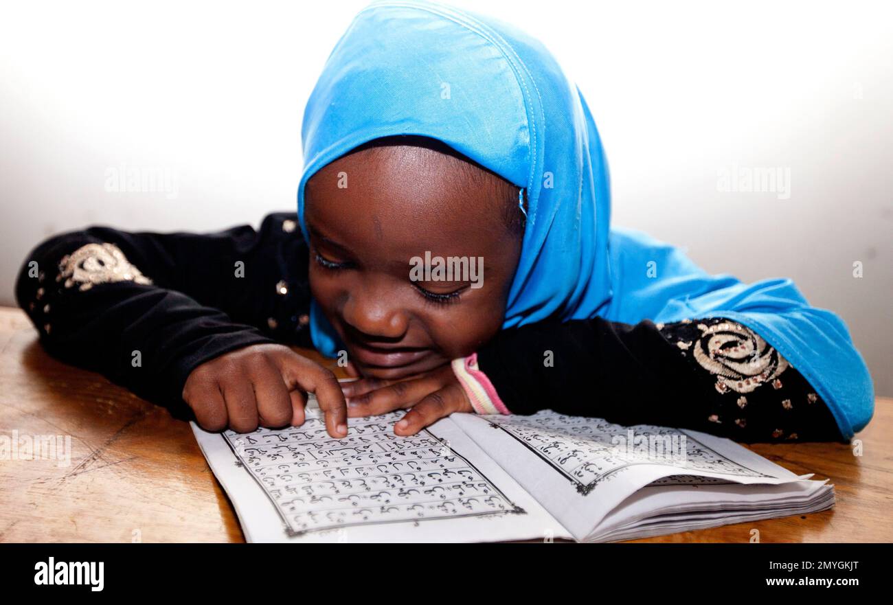 A Kenyan Muslim child reads the Quran on the fifth day of the Muslim