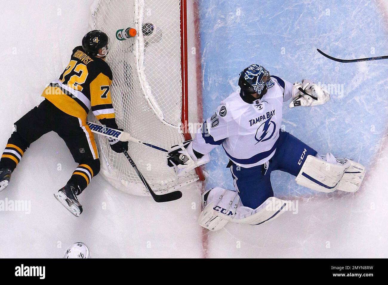 Pittsburgh Penguins' Patric Hornqvist (72) falls against the back of