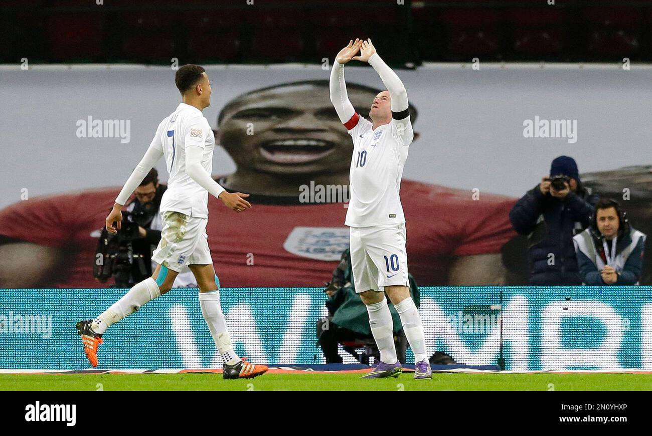 England’s captain Wayne Rooney, right, celebrates with Dele Alli after