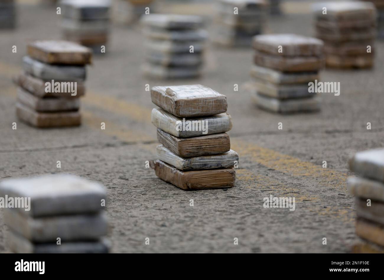 Seized packages containing cocaine are displayed during a press